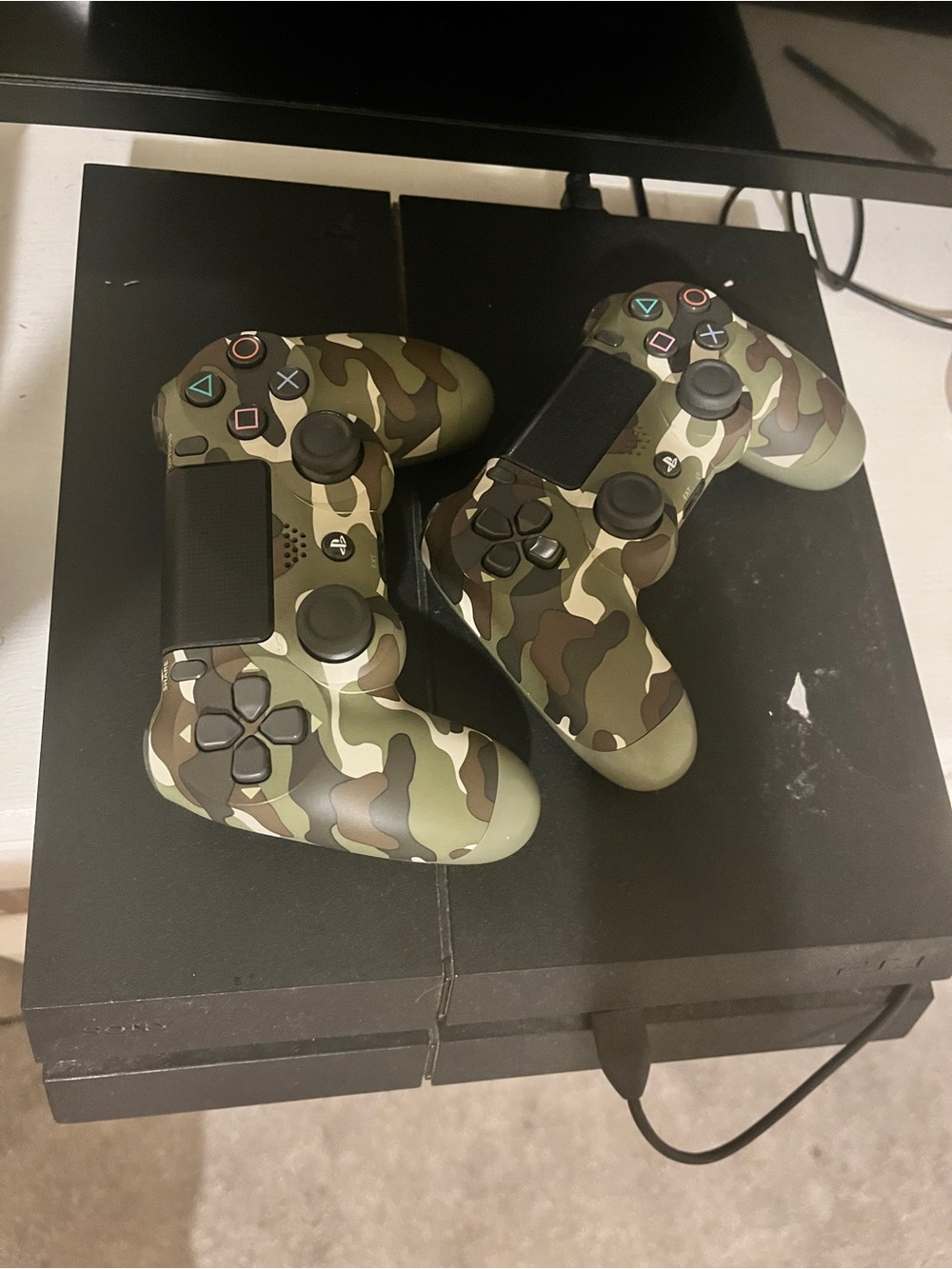 PlayStation 4 with TWO camo controllers